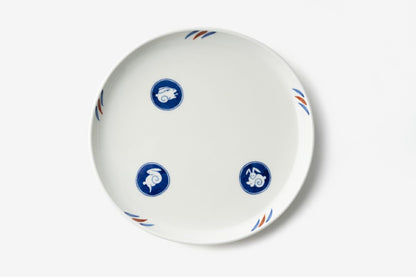 Oval white porcelain plate with blue circular motifs featuring stylized rabbits, accented with blue and terracotta details, embodying the Japanese moon-viewing rabbit theme