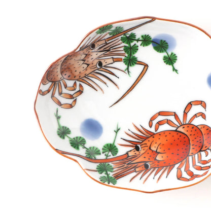 Handcrafted Japanese oval plate featuring vibrant red lobsters, green seaweed, and blue accents on a white background with scalloped edges