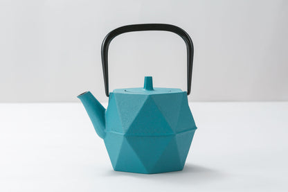 Japanese Kyusu Ishihiki cast iron teapot featuring a striking Hawaiian Blue geometric body with a black arched handle, blending traditional craftsmanship with modern design