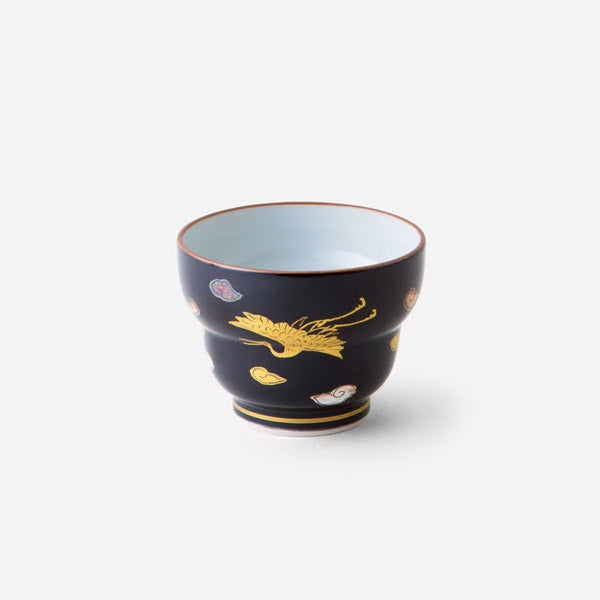 Handcrafted Japanese sake cup with black glaze and gold crane motif, featuring an elegant golden crane design and abstract patterns on a deep black background