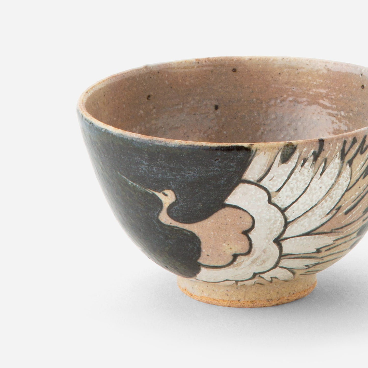 Handcrafted Japanese tea bowl with iron-glazed crane motif, featuring a graceful crane design in light tones against a deep black exterior