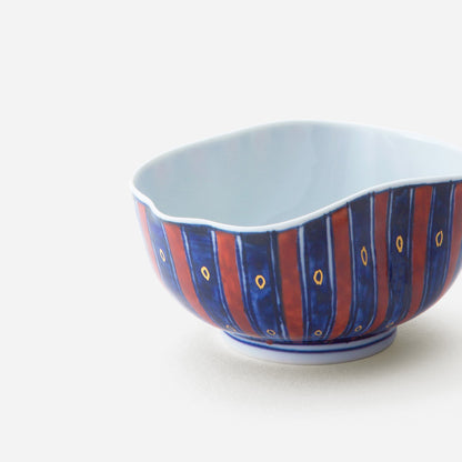 Handcrafted Japanese yunomi tea cup featuring a vibrant tokusa design with alternating blue and red stripes, inspired by Hokusai's original artwork