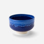 Handcrafted Japanese matcha bowl with deep celestial blue glaze, showcasing a smooth transition from dark to light blue hues reminiscent of a starry night sky