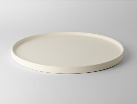 Lotus Large Ceramic Serving Plate in Soft White, showcasing minimalist design for elegant dining