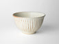 Shinogi Cream Matte Rice Bowl featuring traditional Japanese pottery techniques with elegant vertical grooves, showcasing its versatile size and charming rounded shape