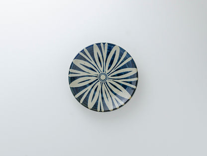 Handcrafted 6-inch round ceramic plate with Persian-inspired floral motif in Kurosu blue, showcasing traditional Japanese kanna-biki technique