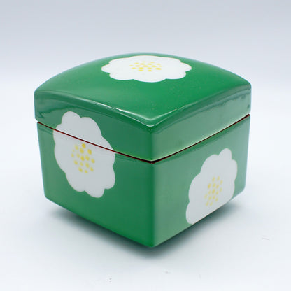 Square green ceramic box with white camellia flower designs and red accent, featuring a removable lid for stylish storage