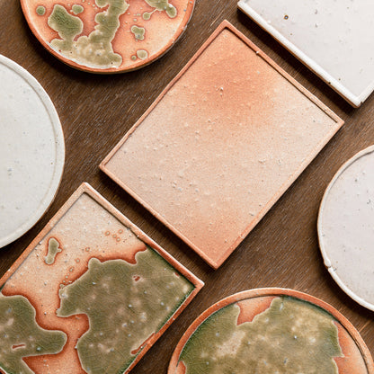 Handcrafted large Koshinraku square ceramic plate with unique green glaze pattern and natural clay accents, showcasing traditional Japanese pottery techniques